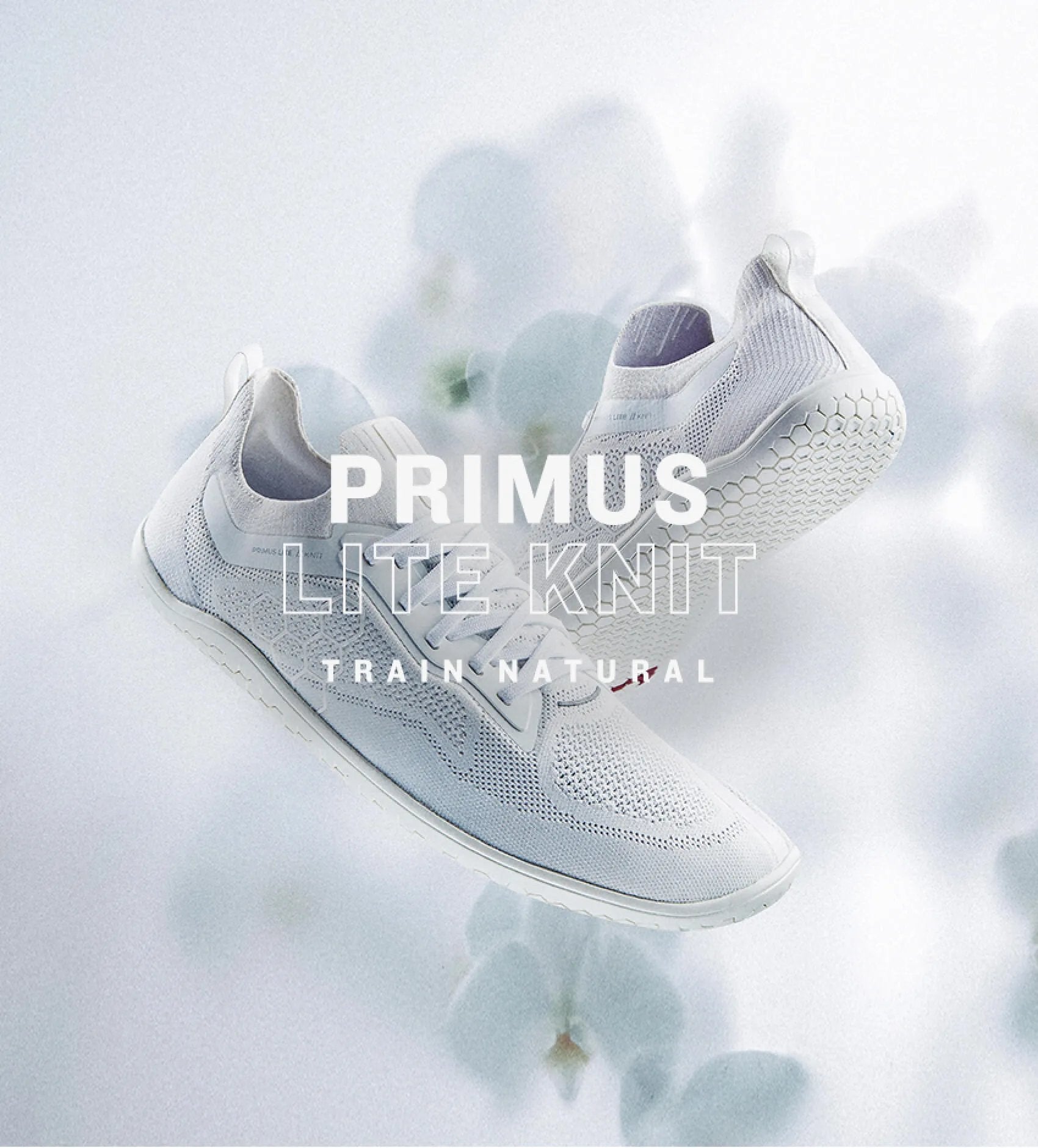 White Vivobarefoot Primus Lite Knit shoes displayed on a neutral background, showcasing their sleek design and knit texture.