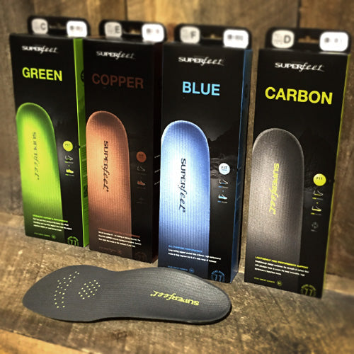 Superfeet insoles displayed, emphasizing their lightweight construction and ergonomic design for improved foot comfort and stability.