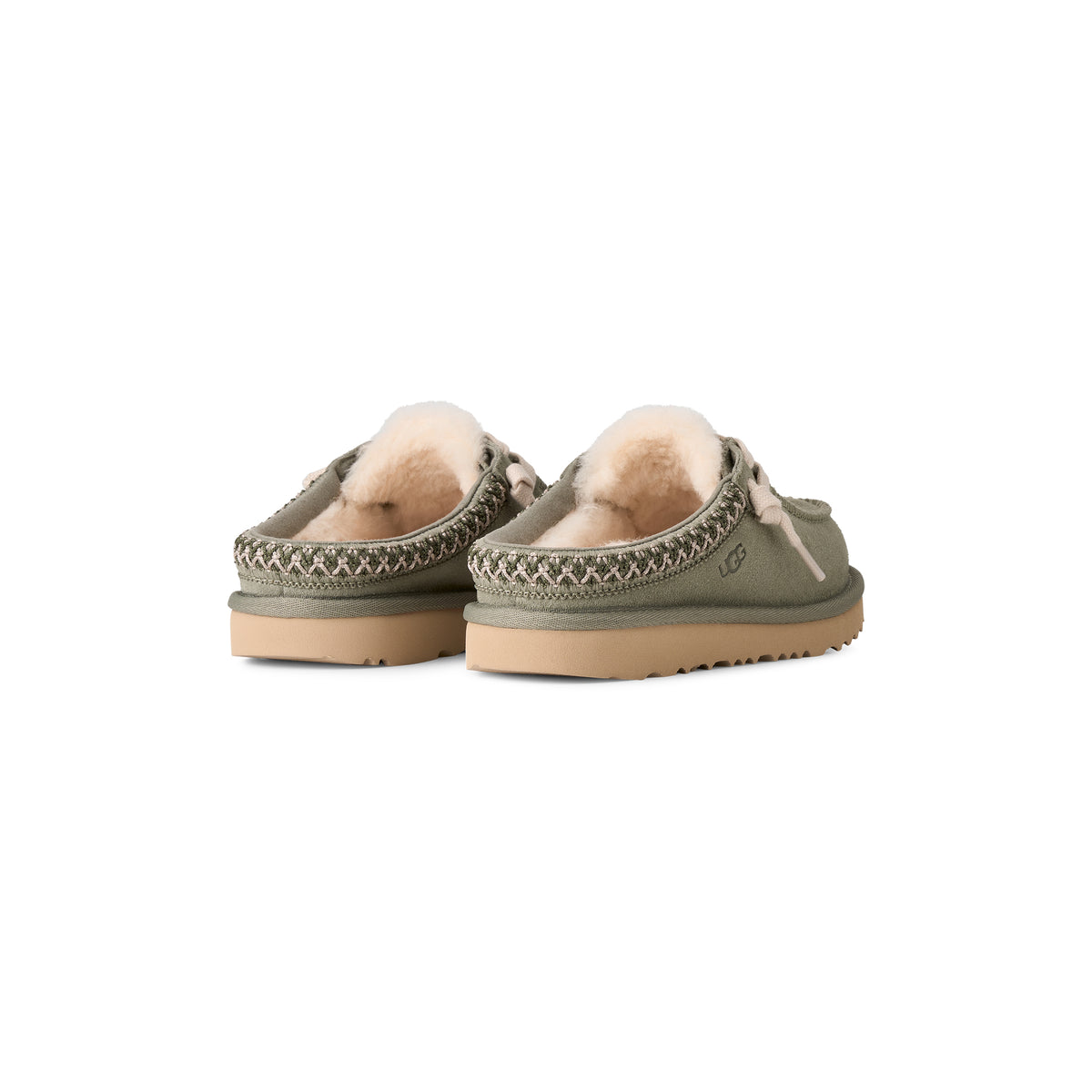 Olive green suede UGG Kid's Tasman mule with UGGplush lining, decorative braided trim, and a tan sugarcane EVA outsole.