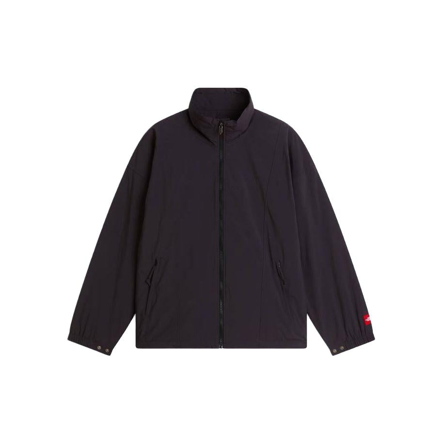 Black The North Face WindWall nylon jacket with a fleece lining, zip front, and signature Red Box logo on the sleeve.