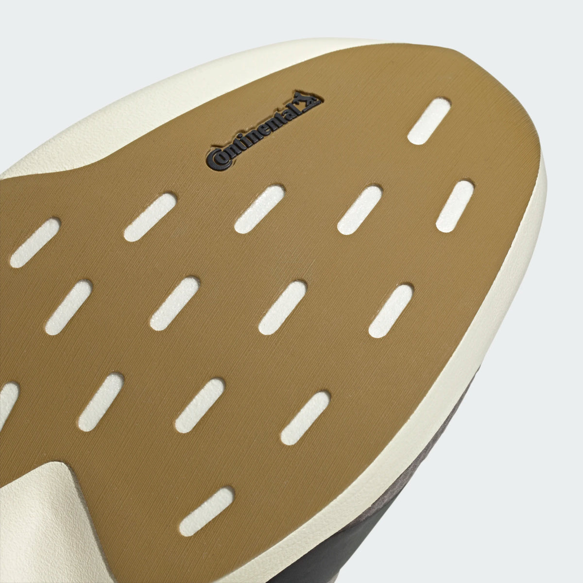 Brown Continental rubber outsole of the Adidas Adizero EVO SL running shoe with a textured, slotted grip pattern.