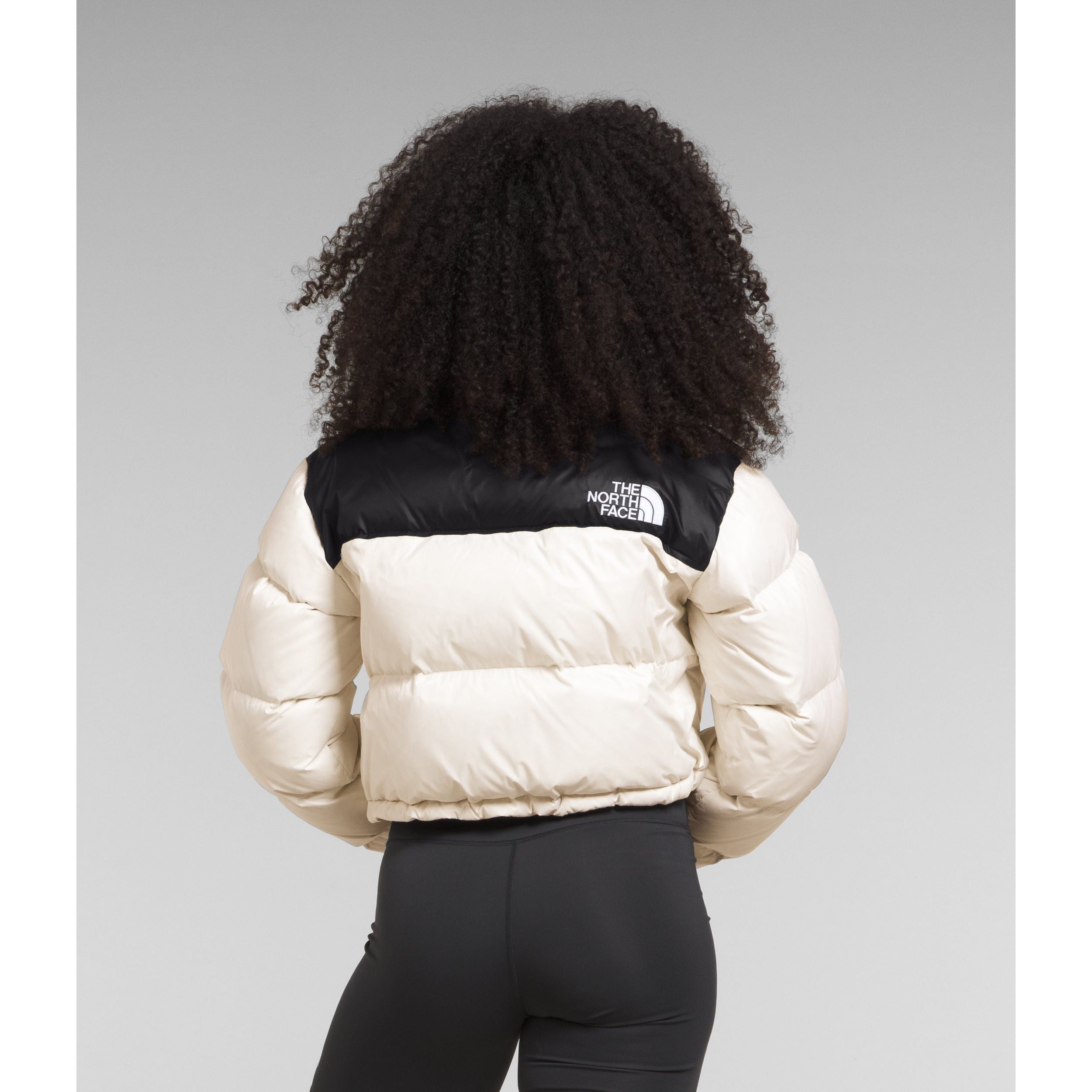 The North Face Women's Nuptse Short Jacket in Gardenia White Black Coats & Jackets