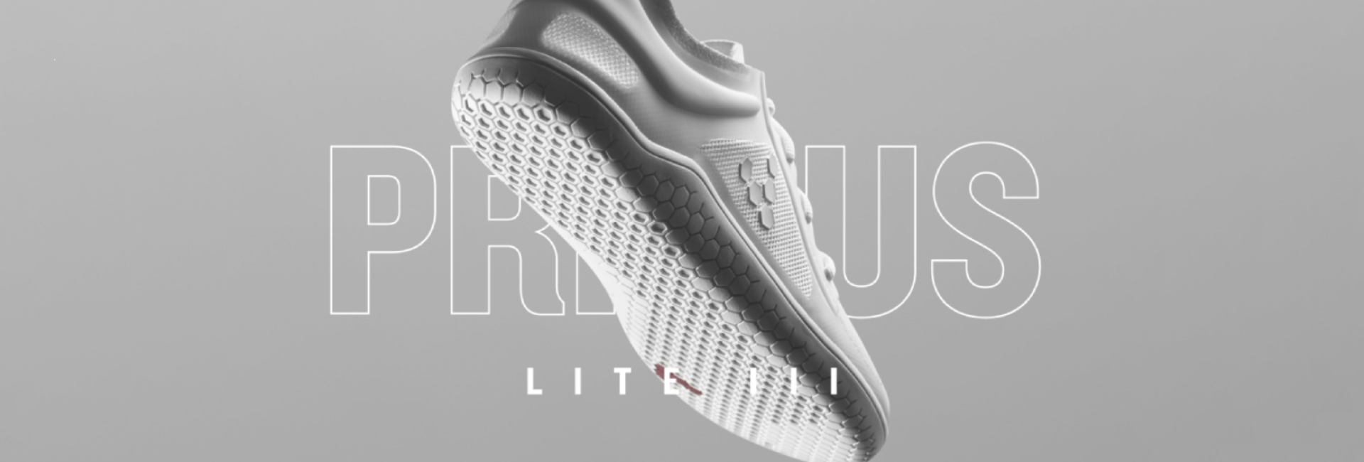 A white Vivobarefoot shoe displayed against a neutral background,
highlighting its sleek design and leather material.