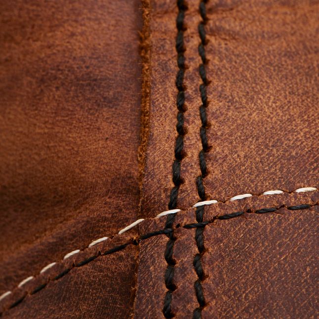 Close-up of Copper Rough & Tough leather on a Red Wing Blacksmith boot with durable Puritan triple-stitch construction.