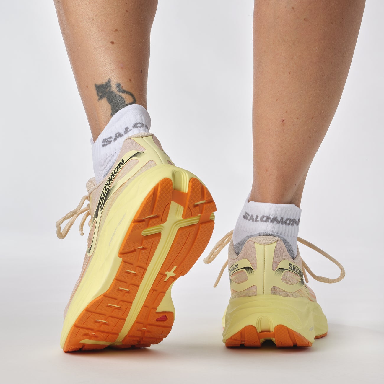 Salomon Women's Aero Glide Running Shoes in Tender Peach Yellow Iris White Women's Footwear