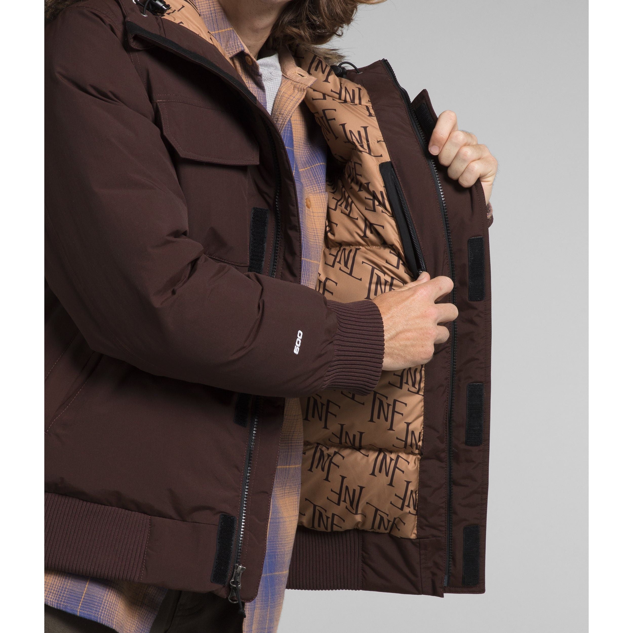 The North Face Men's McMurdo Bomber in Coal Brown Almond Butter Monogram Print  Men's Apparel