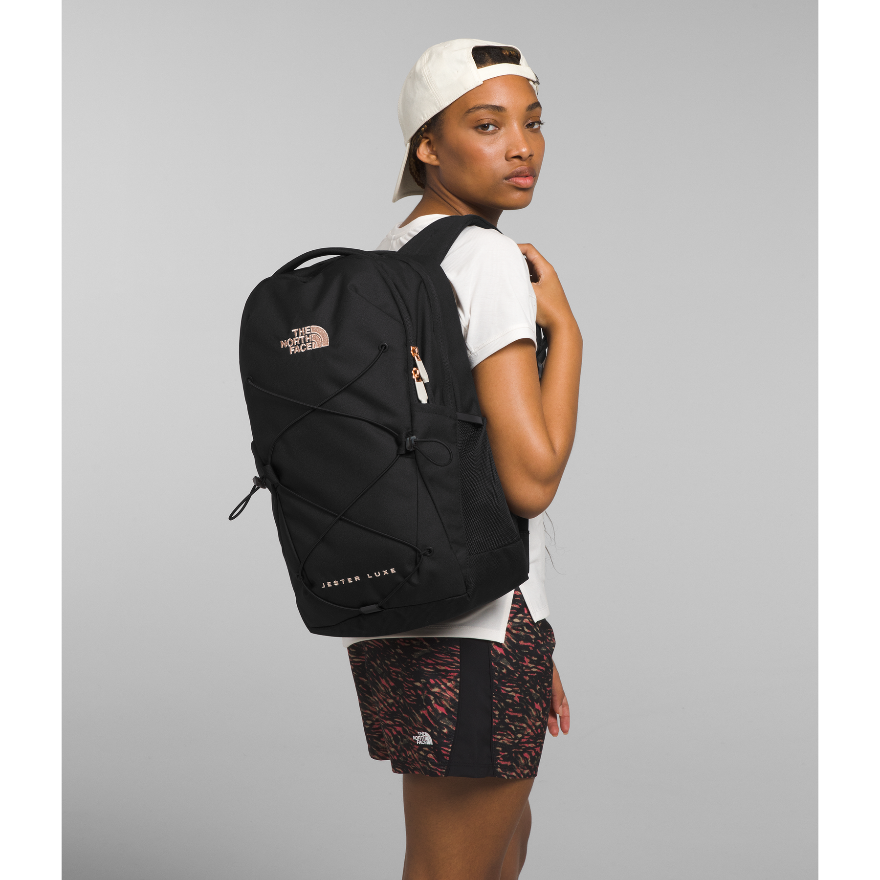 The North Face Women s Jester Luxe in Black Burnt Coral Metallic