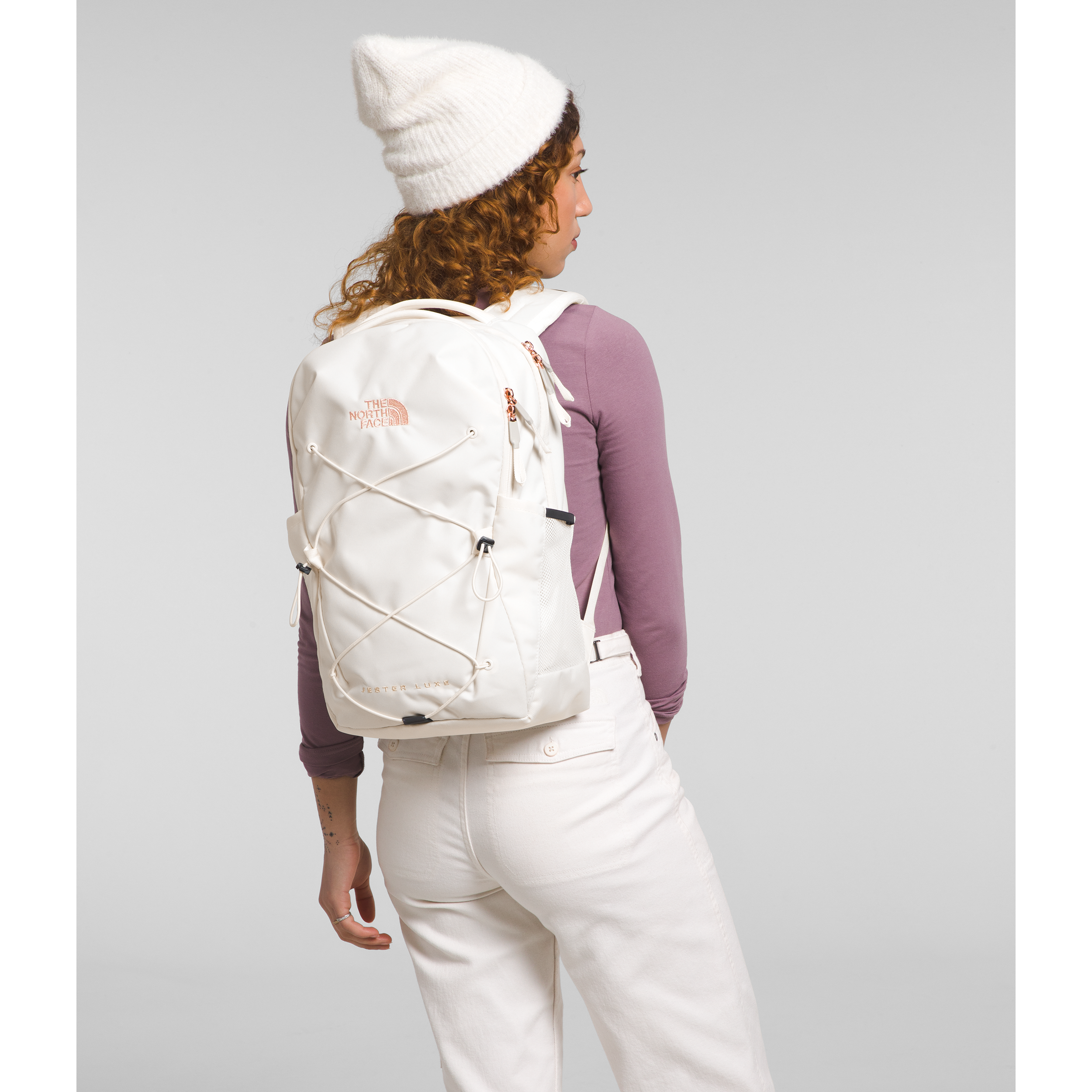 The North Face Women's Jester Luxe Backpack in Gardenia White/Burnt Coral Metallic  Accessories