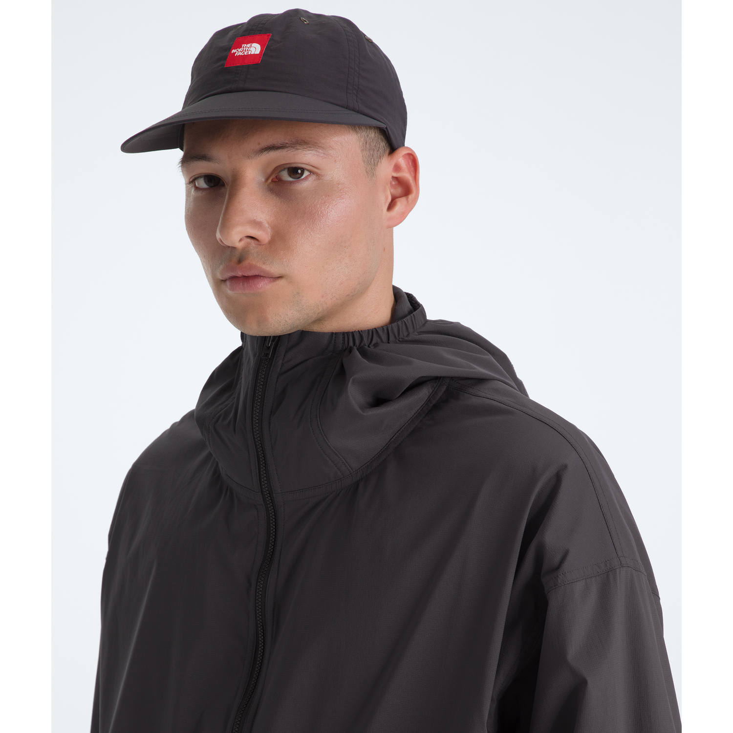 The North Face Men's Red Box Packable Hooded Wind Jacket in Obsidian