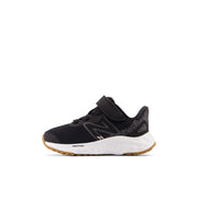 New Balance Infant's Fresh Foam Arishi V4 Bungee Lace with Top Strap in Black with White  Kid