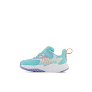 New Balance Kids' Crib & Toddlers Rave Run v2 Bungee Lace w Hook & Loop Top Strap in Surf w Peach Glaze & Magic Hour  Kid's Footwear